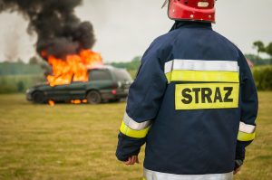 Firefighter Extinguish Car Fire